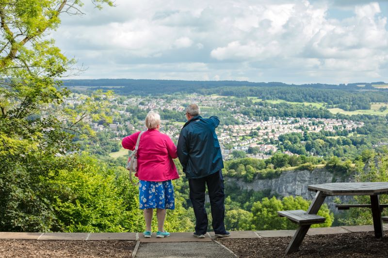 Two elderly people looking over Matlock at the Heights of Abraham